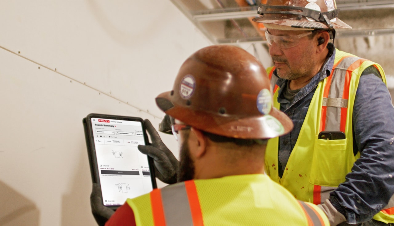 Man installing firestop sleve