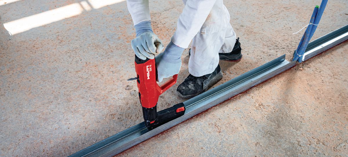 Installing drywall track with powder-actuated tool DX 6 MX and X-C MX.