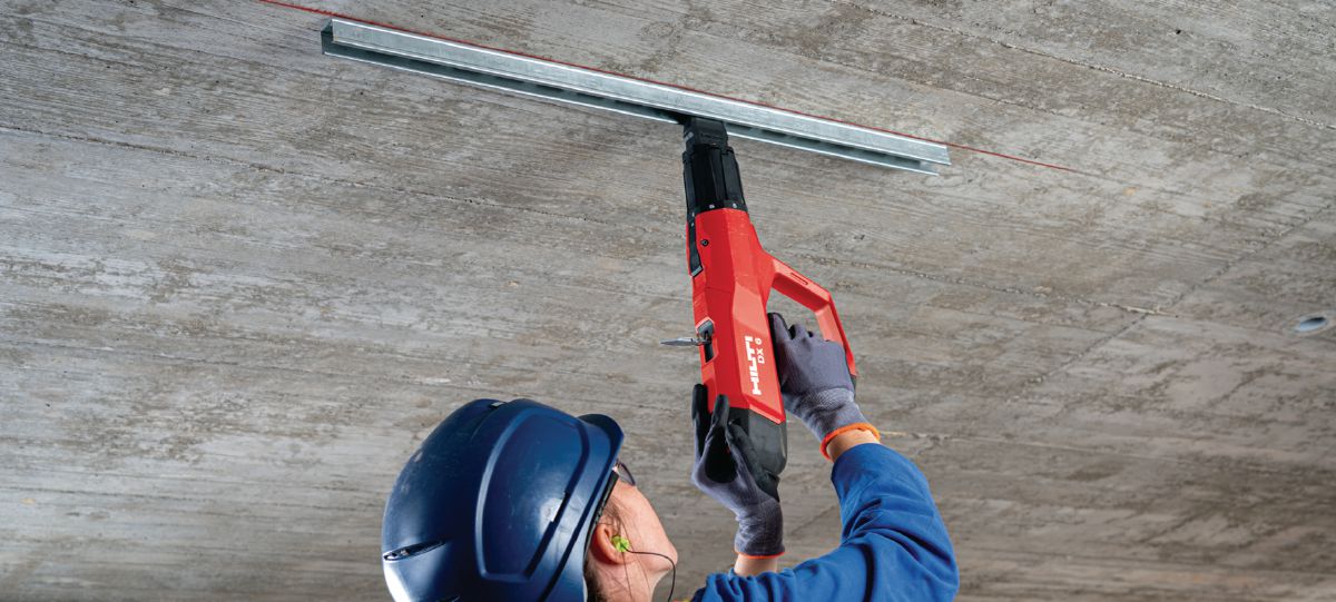 Fastening installation channel with powder-actuated tool DX 6-F8 pole tool