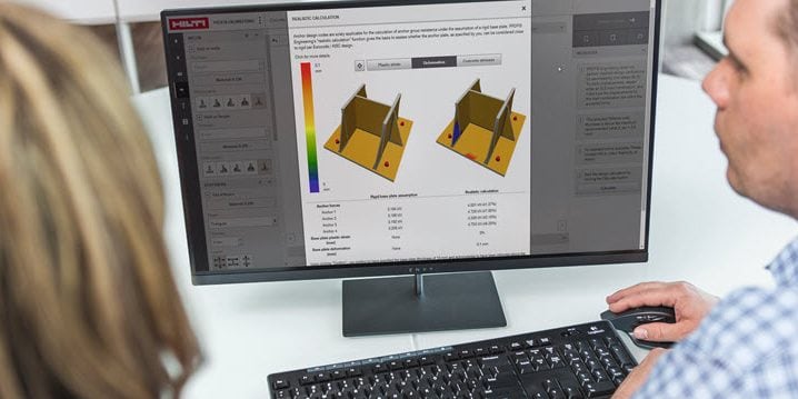 2 people working with Hilti design software infront of a screen