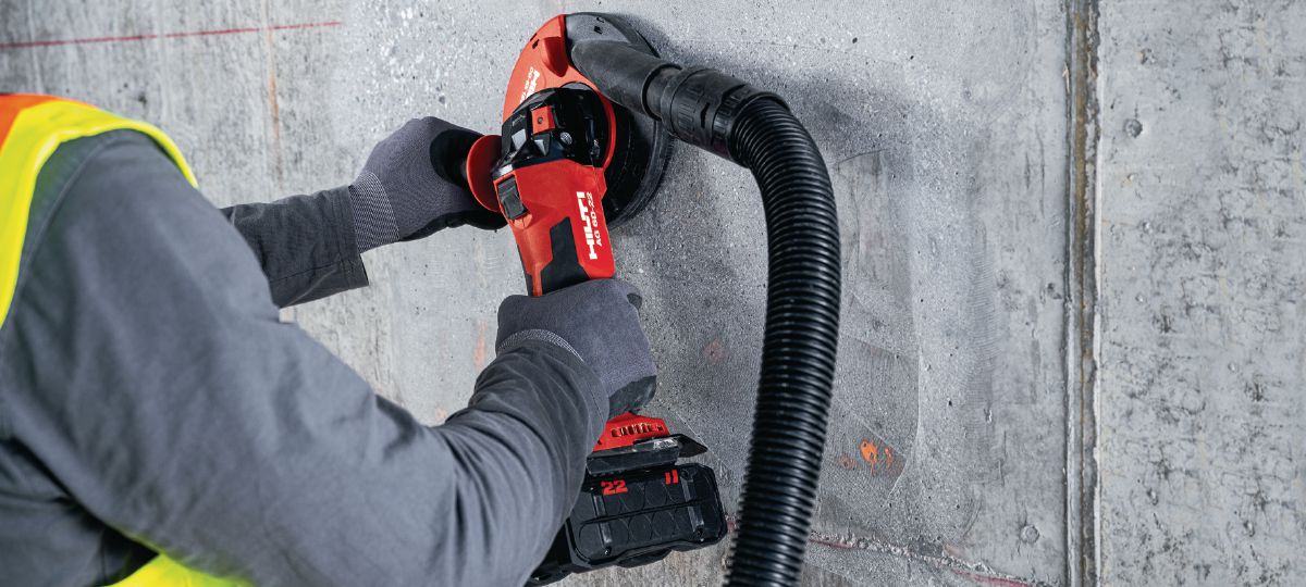 Cordless angle grinder AG 6D-22 concrete grinding application.