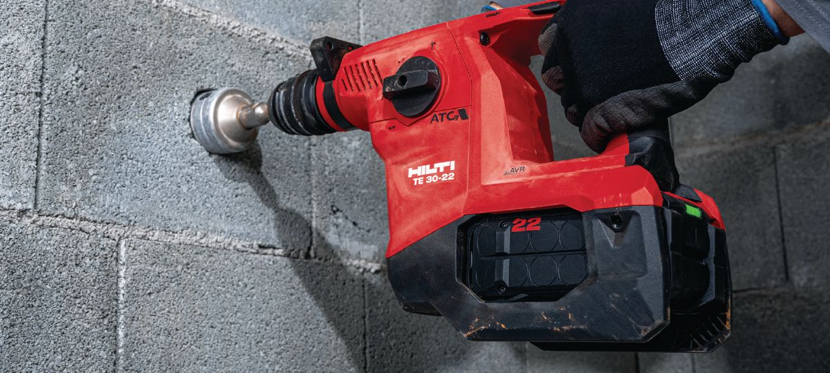 Opening a socket on grey brick masonry with our cordless SDS-Plus rotary hammer TE 30-22
