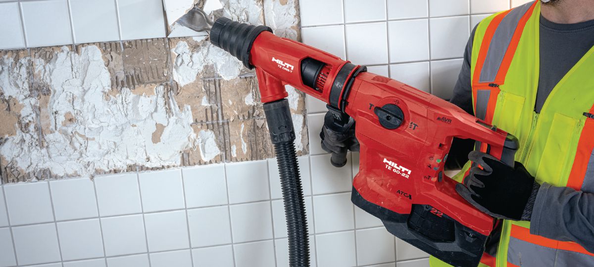 Removing tiles with powerful SDS-Max combihammer TE 60-22 with flat chisel and DRS-Y