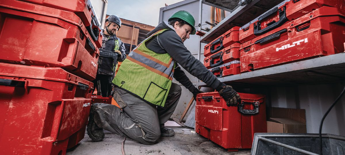 Cropped application picture of a worker placing the XL ProKit case in the jobsite.