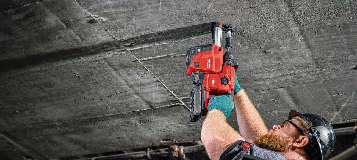 Cropped application picture of a worker using TE 6-22 with 2-in-1 HDI and EXO-S to install HDI-TZ anchors. Produced by HNA. Dallas, TX, March 8, 2024.